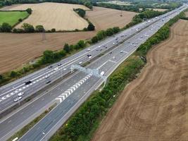High Angle View of British Motorways with Traffic. The Aerial footage of British Roads and Motorways at between M1 Junction 7 and 9 at Sunset. The Footage captured on 09-07-2022 with drone's camera photo