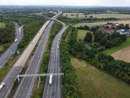 High Angle View of British Motorways with Traffic. The Aerial footage of British Roads and Motorways at between M1 Junction 7 and 9 at Sunset. The Footage captured on 09-07-2022 with drone's camera photo