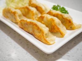 Gyoza dumplings with vegetables photo