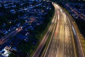High Angle View of British Motorways with Traffic. The Aerial footage of British Roads and Motorways at between M1 Junction 7 and 9 at Sunset. The Footage captured on 09-07-2022 with drone's camera photo