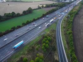 High Angle View of British Motorways with Traffic. The Aerial footage of British Roads and Motorways at between M1 Junction 7 and 9 at Sunset. The Footage captured on 09-07-2022 with drone's camera photo