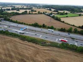 High Angle View of British Motorways with Traffic. The Aerial footage of British Roads and Motorways at between M1 Junction 7 and 9 at Sunset. The Footage captured on 09-07-2022 with drone's camera photo