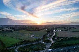 High Angle View of British Motorways with Traffic. The Aerial footage of British Roads and Motorways at between M1 Junction 7 and 9 at Sunset. The Footage captured on 09-07-2022 with drone's camera photo