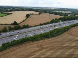 High Angle View of British Motorways with Traffic. The Aerial footage of British Roads and Motorways at between M1 Junction 7 and 9 at Sunset. The Footage captured on 09-07-2022 with drone's camera photo