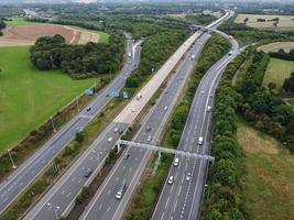 High Angle View of British Motorways with Traffic. The Aerial footage of British Roads and Motorways at between M1 Junction 7 and 9 at Sunset. The Footage captured on 09-07-2022 with drone's camera photo