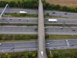 High Angle View of British Motorways with Traffic. The Aerial footage of British Roads and Motorways at between M1 Junction 7 and 9 at Sunset. The Footage captured on 09-07-2022 with drone's camera photo