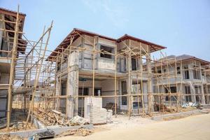 house under construction with autoclaved aerated concrete block structure at building site photo