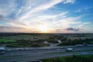 High Angle View of British Motorways with Traffic. The Aerial footage of British Roads and Motorways at between M1 Junction 7 and 9 at Sunset. The Footage captured on 09-07-2022 with drone's camera photo