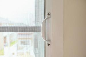 mosquito net wire screen on house window protection against insect photo