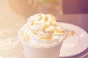 fresh caramel latte with whipped cream photo