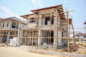 house under construction with autoclaved aerated concrete block structure at building site photo