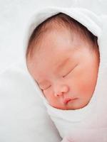 Newborn baby girl sleeping photo