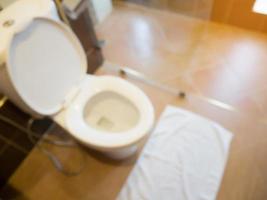 White toilet bowl in the bathroom blur background photo