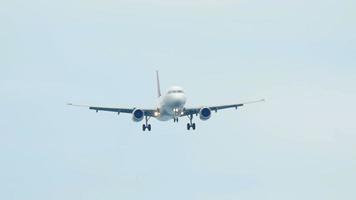 Airplane approaching before landing at Phuket airport, slow motion video
