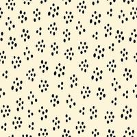 Abstract seamless pattern with black speckles on a beige background. Vector hand drawn illustration