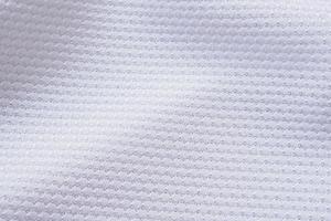 fondo de ropa deportiva de textura de tela de ropa de camiseta de fútbol blanca foto
