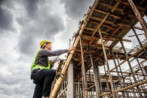 professional engineer worker at the house building construction site photo