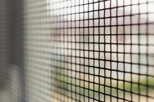 mosquito net wire screen on house window protection against insect photo