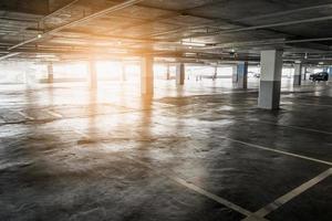 interior of empty vacant car parking garage in department store photo