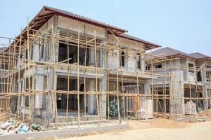house under construction with autoclaved aerated concrete block structure at building site photo