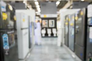 abstract blur row of refrigerator in electronic store background photo