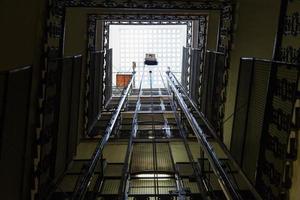 lift shaft in old multi-storey building photo