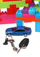 keys, model car, plastic block house photo