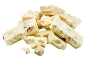 pile of broken white chocolate with hazelnuts photo