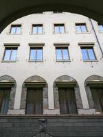 view of facade of old apartment house in Florence photo