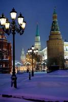 Kremlin towers in winter snowing evening, Moscow photo