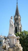 statue of Pradier fountain in Nimes city photo