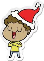 laughing sticker cartoon of a man wearing santa hat vector