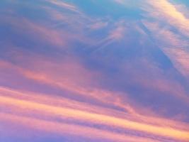 pink sunset clouds in blue evening sky photo