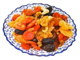 dried fruits on arabic plate isolated photo