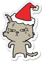 tough sticker cartoon of a cat wearing santa hat vector