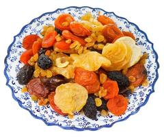 dried sweet fruits on turkish plate photo