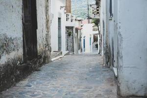 Narrow and colorful street in the village of Kritsa in the island of Crete photo