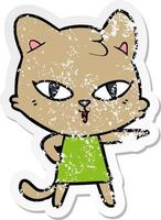 distressed sticker of a cartoon cat in dress pointing vector