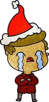 textured cartoon of a man crying wearing santa hat vector