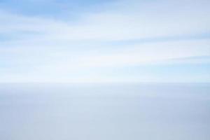 view of horizon line between blue sky and sea photo