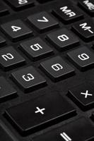 digit keys of black calculator close up photo