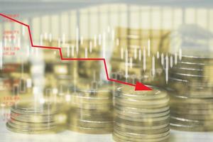 Double exposure Stock market investment trading financial coins with graph on virtual screen. Business saving money accounting economy concept. photo