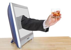 whisky glass in businessman hand leans out TV photo