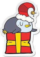 sticker of a cartoon penguin wearing christmas hat vector