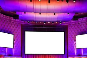 screens in pink, red and purple illuminated cinema photo