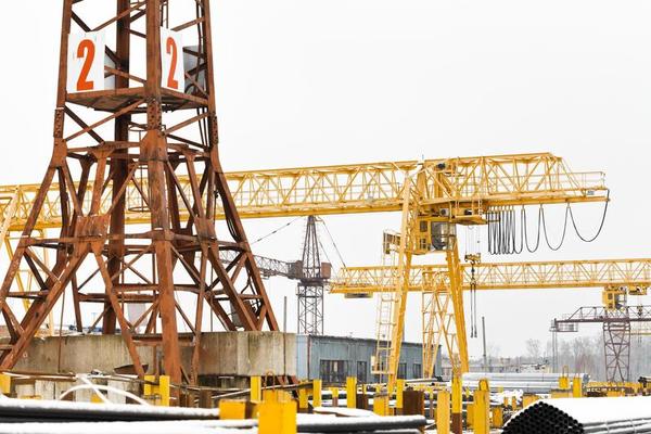 tower and gantry cranes in metal product warehouse