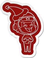 cartoon  sticker of a laughing astronaut wearing santa hat vector