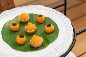 2 Traditional elegance Thai sweet desserts are JaMongKut Chief Crown and SaNayCha Charming Moon. They are lucky and good fortune desserts in Thailand. photo