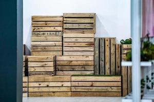 wood box chair in the row and the arrangement nearby wall, ready to pick up to use photo