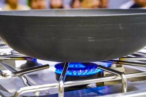 The Gas fire from the stove with the pan on it, in the training - study cooking classroom. photo